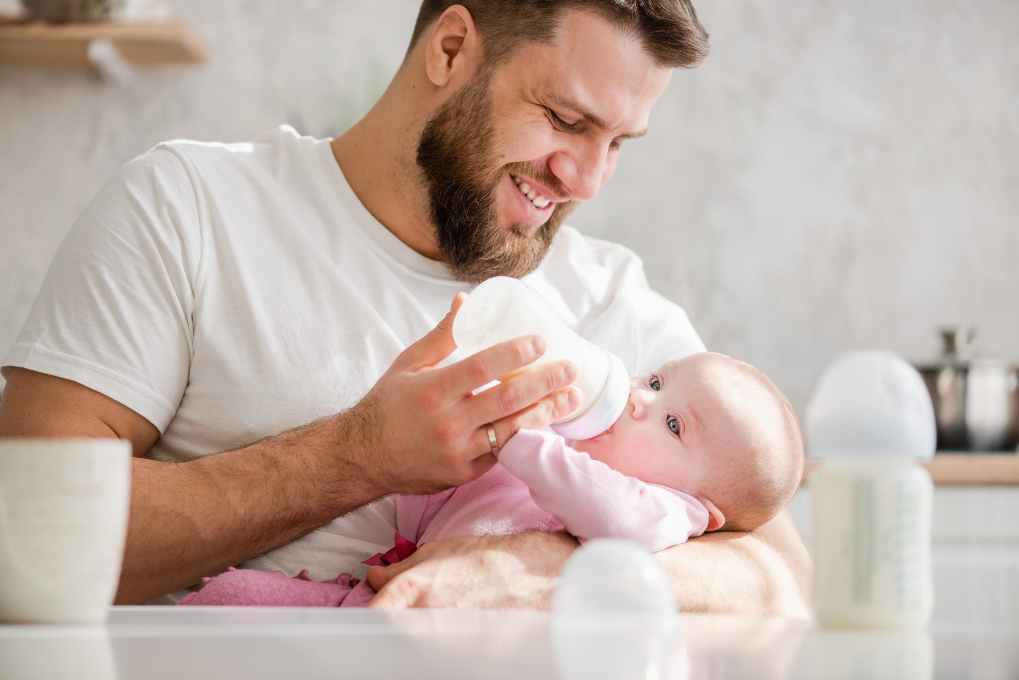 supportive partner feeding baby